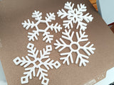 Set of 4 snowflake-shaped coasters