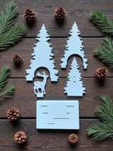 Christmas decoration with deer and tree design, tealight holder slot visible from the back