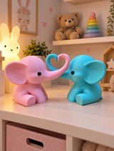 Pair of elephants in light blue and pink with trunks forming a heart in a nursery