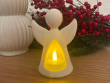 Angel figure with LED tealight glowing from inside