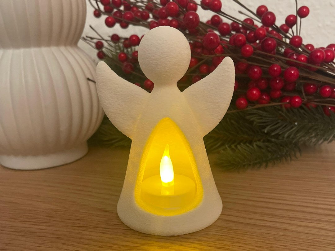 Angel figure with LED tealight glowing from inside