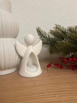Angel figure with LED tealight glowing from inside