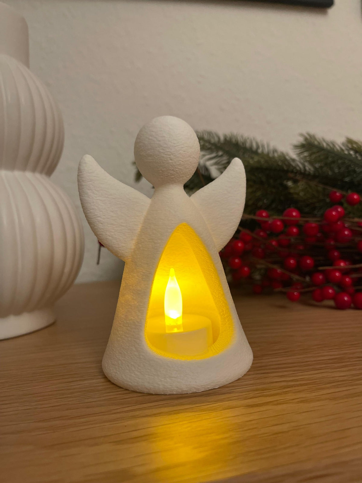 Angel figure with LED tealight glowing from inside