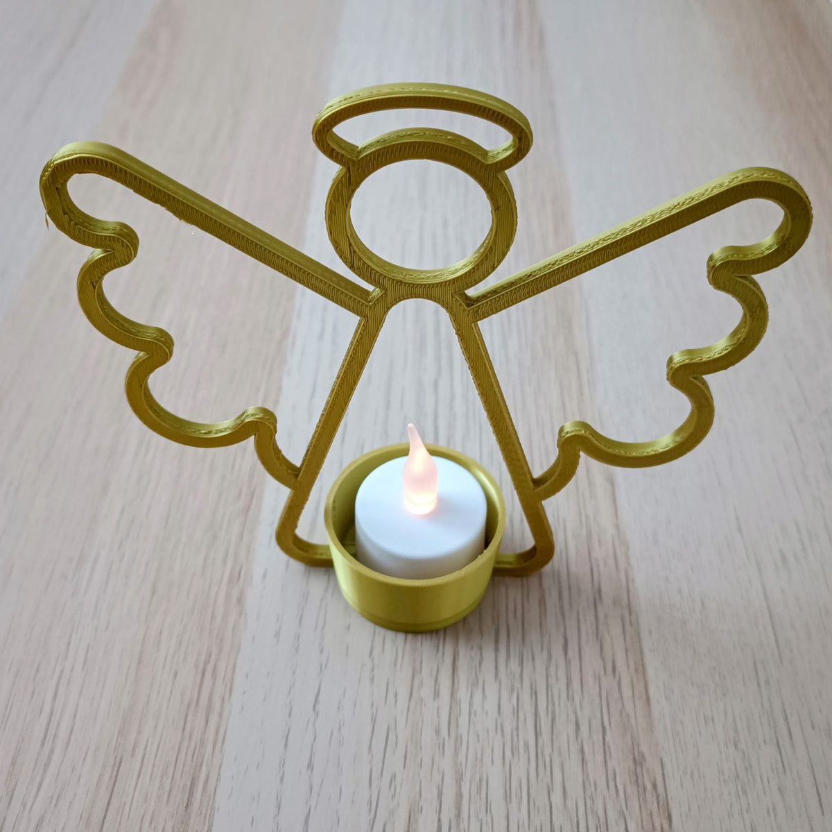 Angel tealight holder with LED tealight in the center