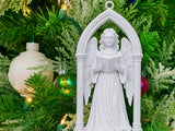 Victorian angel in a Gothic archway as a Christmas tree ornament