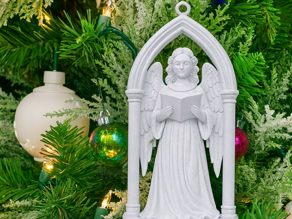 Victorian angel in a Gothic archway as a Christmas tree ornament