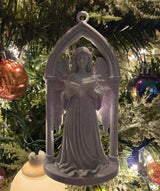 Victorian angel in a Gothic archway as a Christmas tree ornament