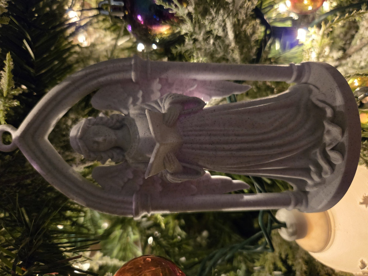 Victorian angel in a Gothic archway as a Christmas tree ornament