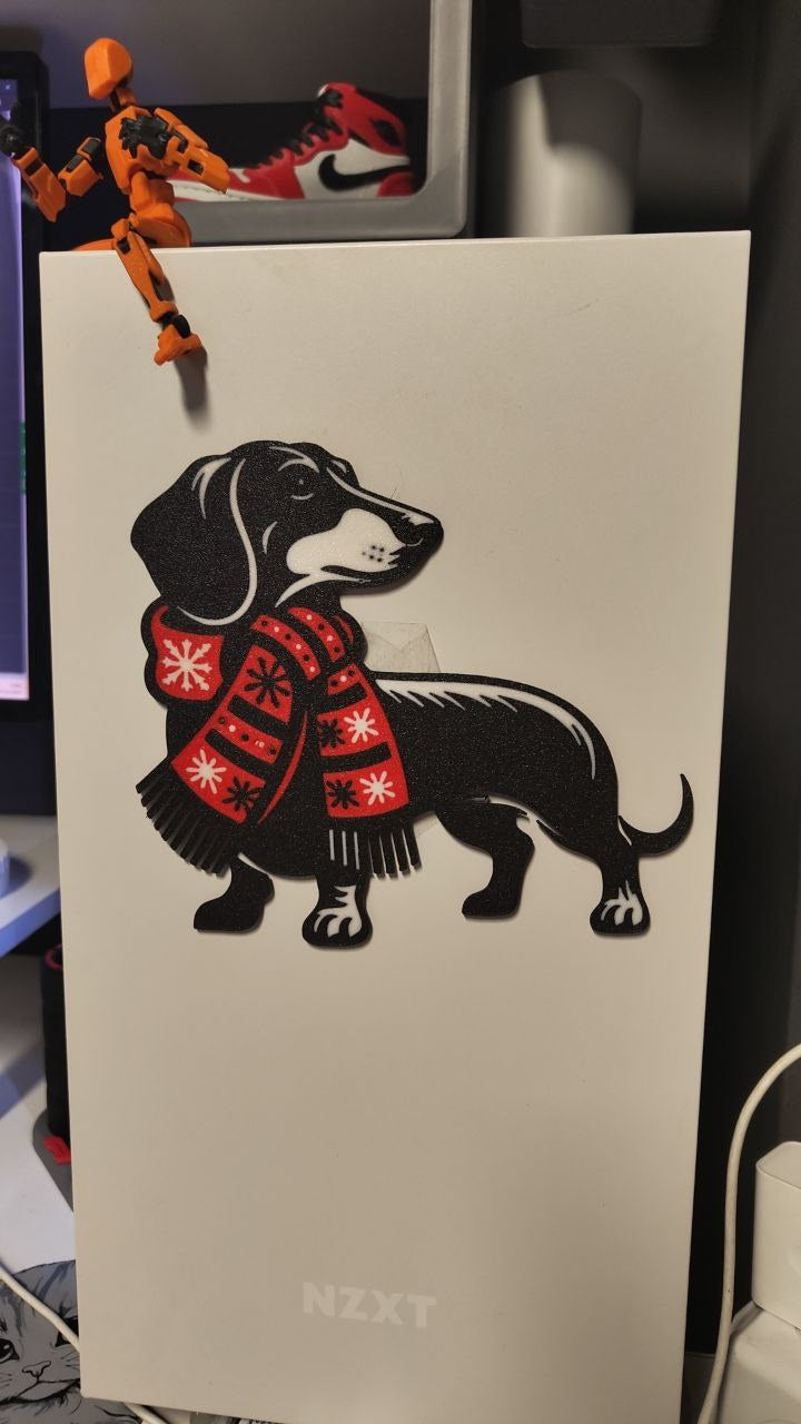 Wall decoration with a dachshund in a festive Christmas mood
