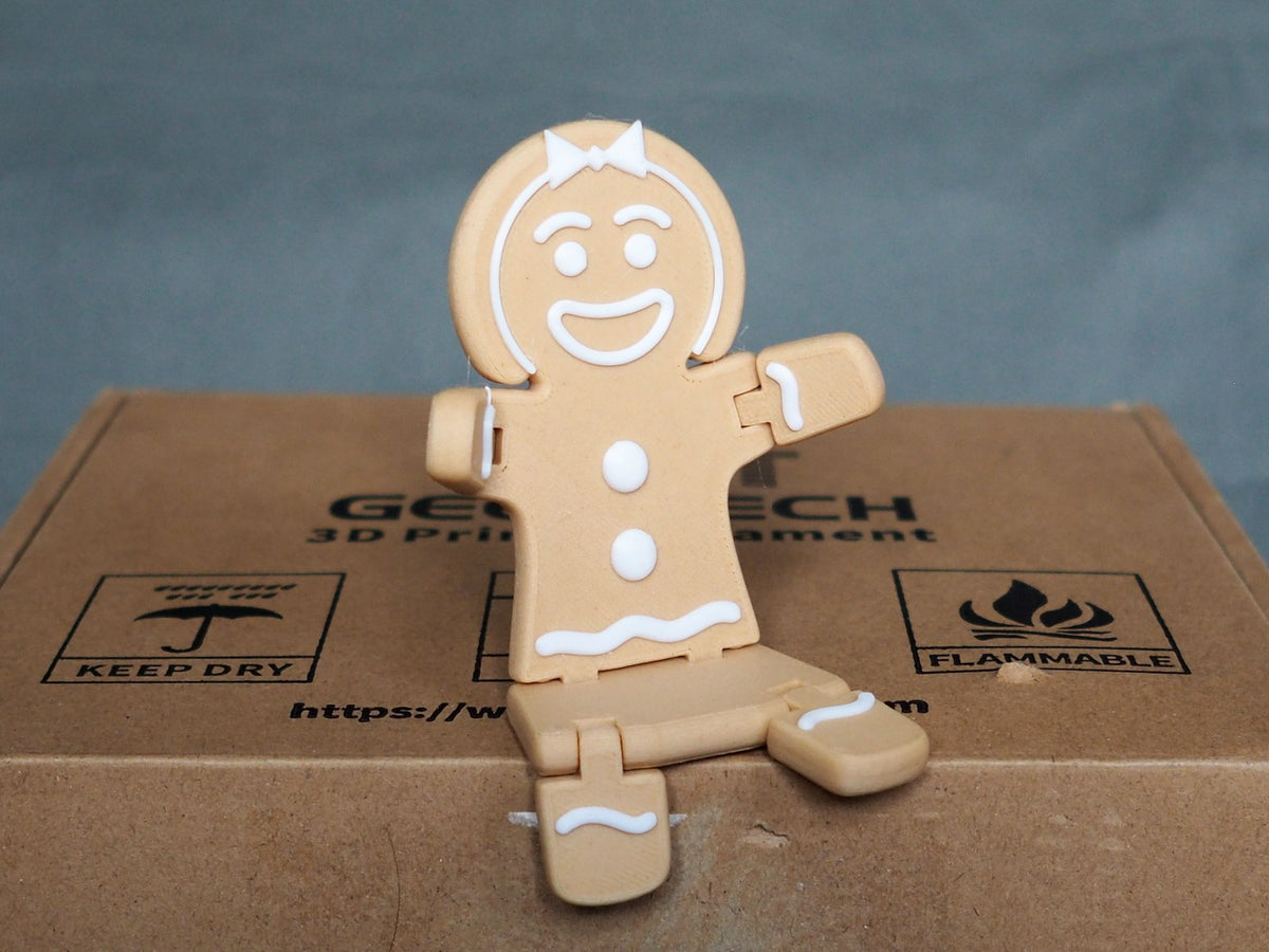 Gingerbread woman figure for Christmas in brown and white