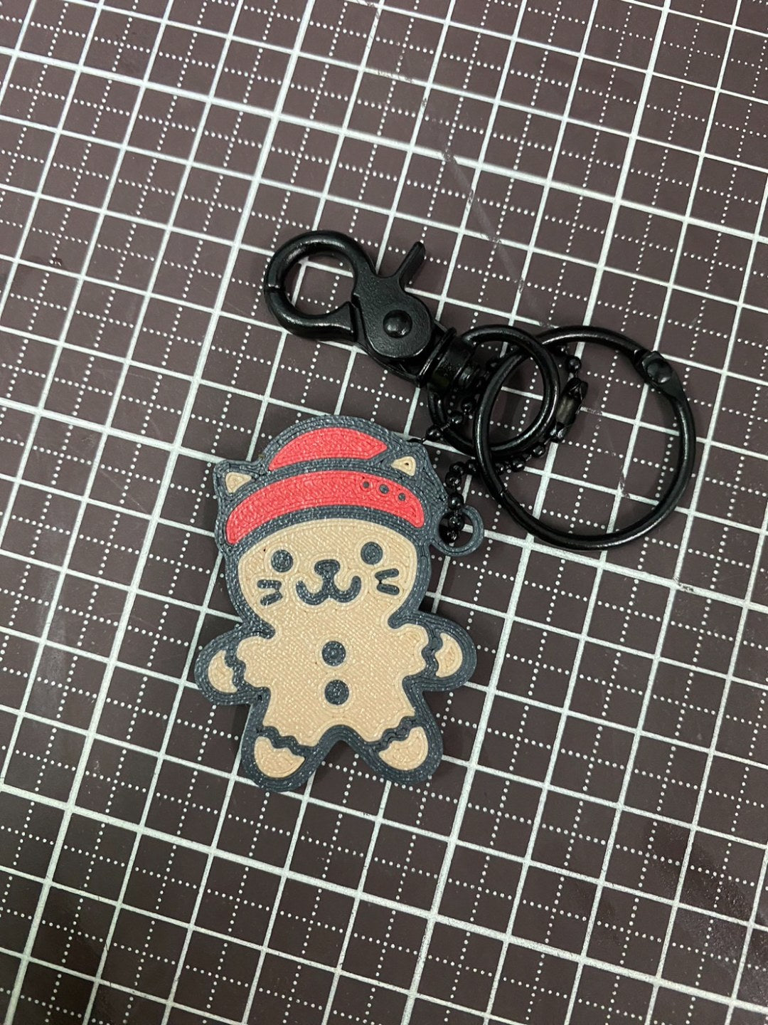 Gingerbread cat in three colors as a Christmas tree ornament