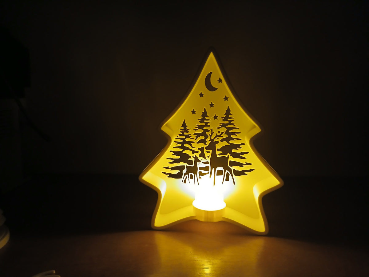 Christmas tree tealight holder with forest scene and reindeer