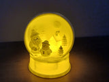 Winter village in a snow globe shape with room for an LED tealight