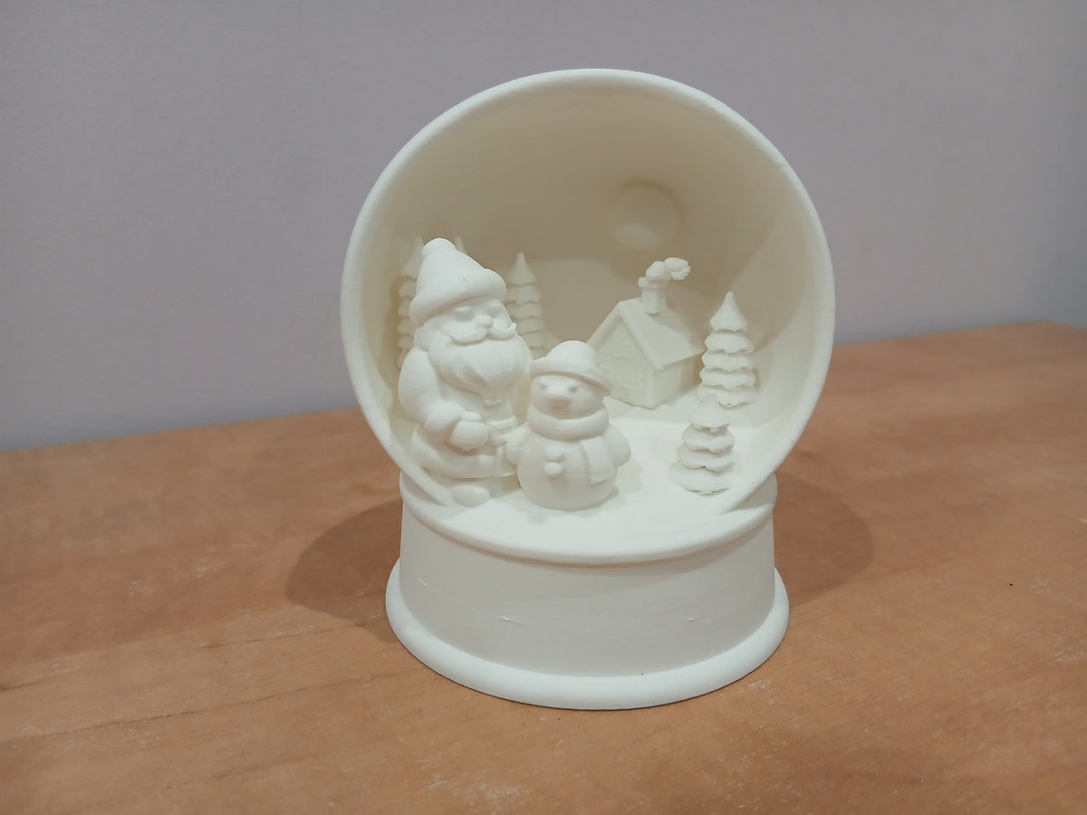 Winter village in a snow globe shape with room for an LED tealight