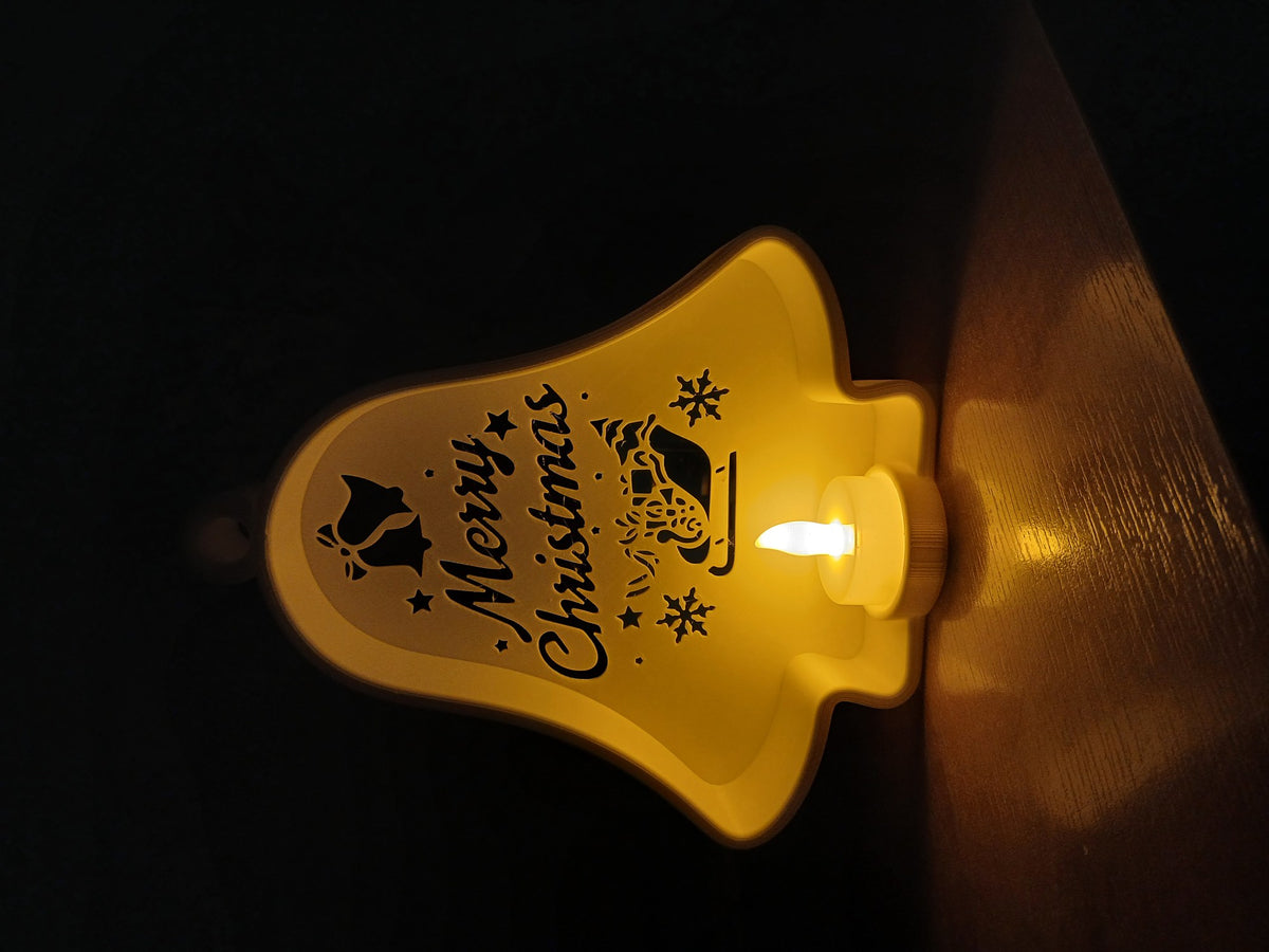 Christmas bell with cut-outs and LED tealight