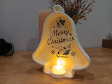 Christmas bell with cut-outs and LED tealight