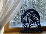 Nativity silhouette with Joseph, Mary, baby Jesus and star