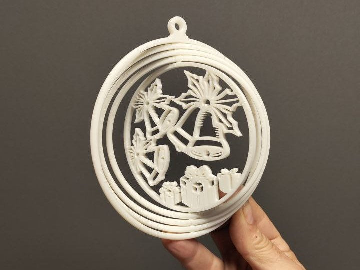 Christmas bauble with presents and bells