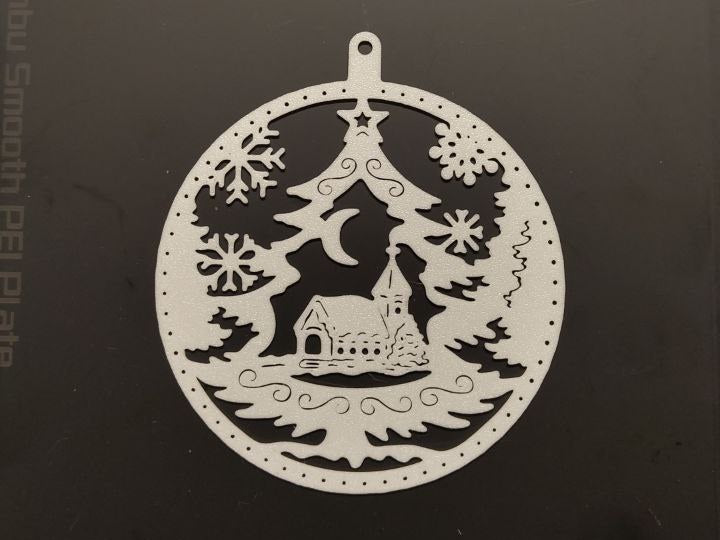 Christmas bauble with house and Christmas tree