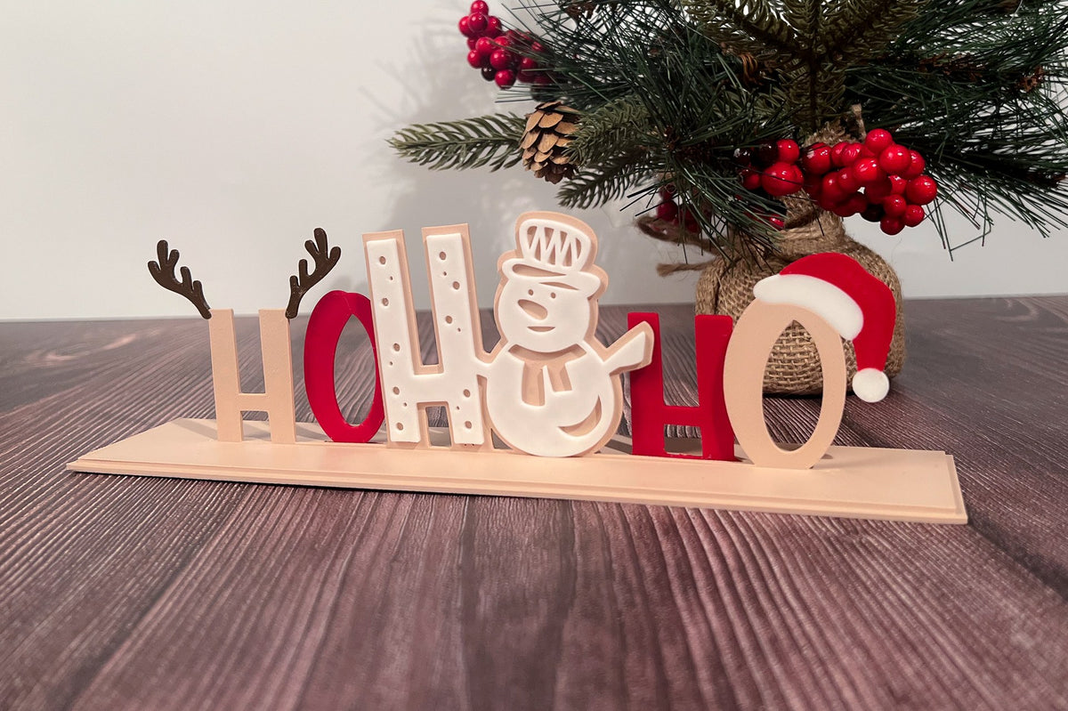 Christmas decoration with the text Ho Ho Ho in four colors