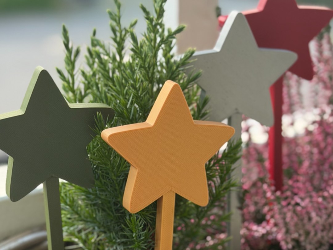 Christmas star on a stick for a plant pot
