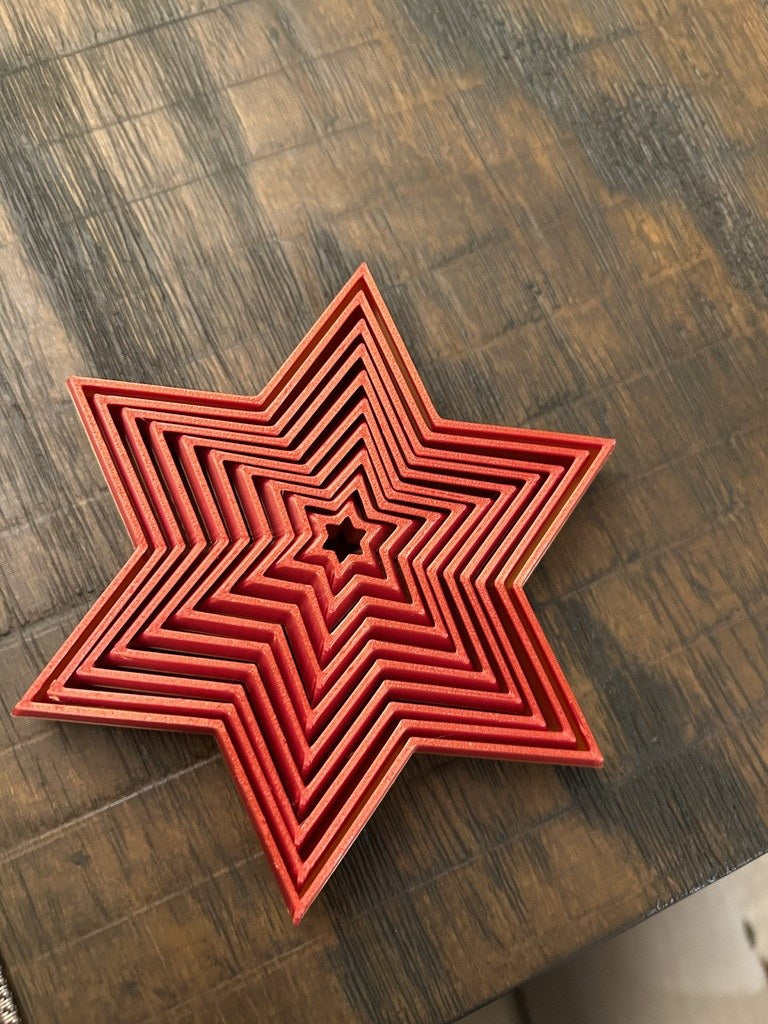 Foldable six-pointed Christmas star in several colours