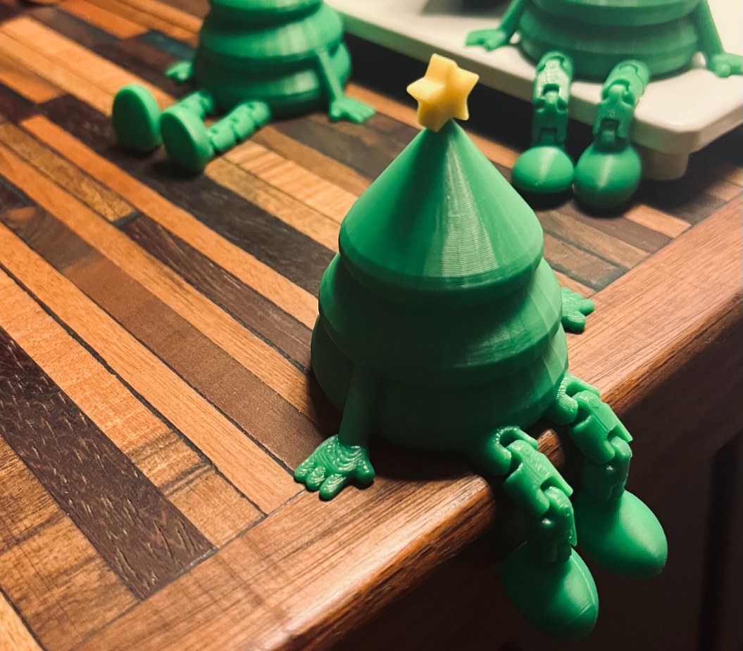 Small green Christmas tree figure with a yellow star