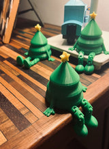 Small green Christmas tree figure with a yellow star
