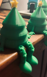Small green Christmas tree figure with a yellow star