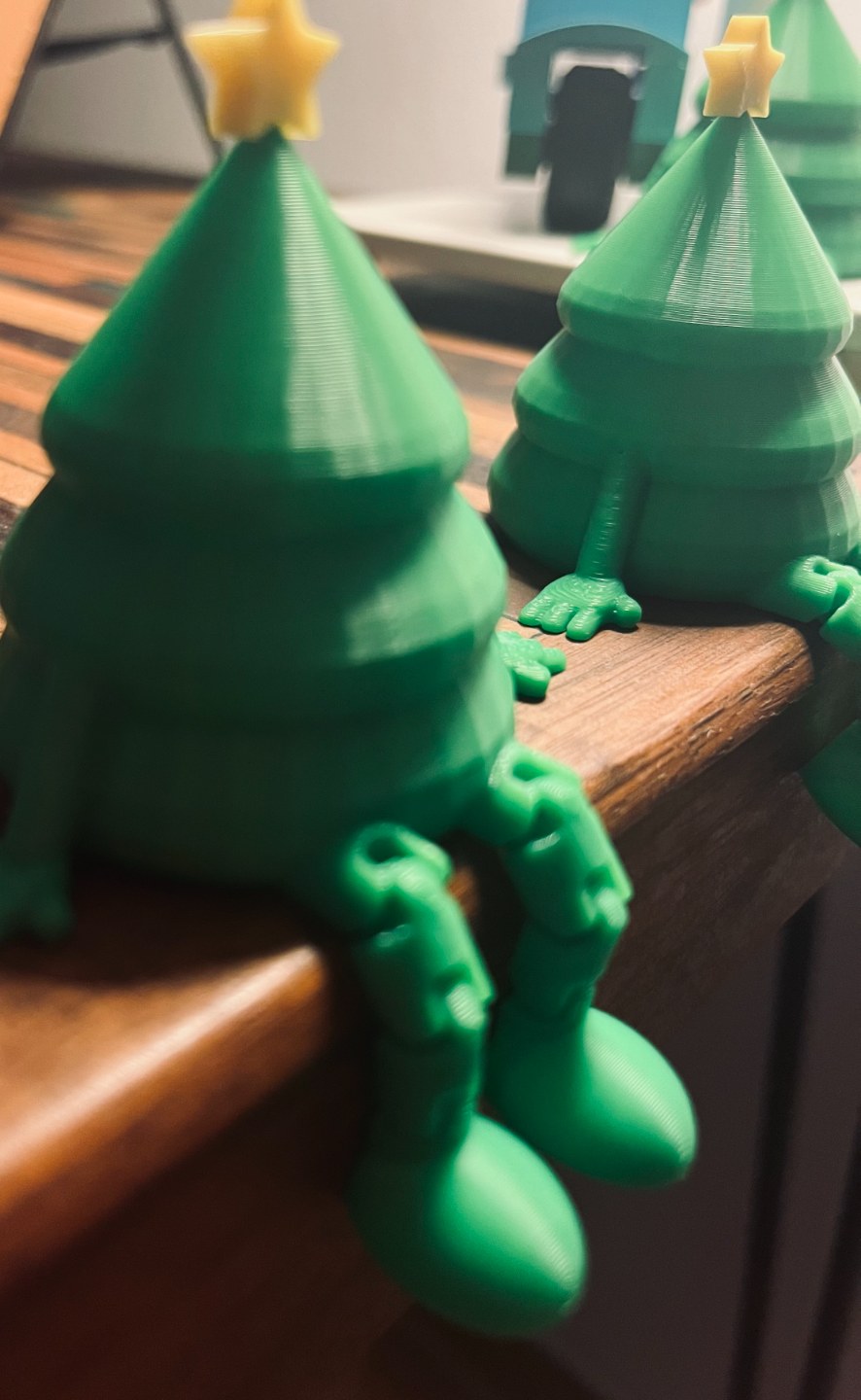 Small green Christmas tree figure with a yellow star