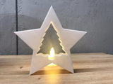 Christmas tree surrounded by a star-shaped frame