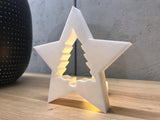 Christmas tree surrounded by a star-shaped frame