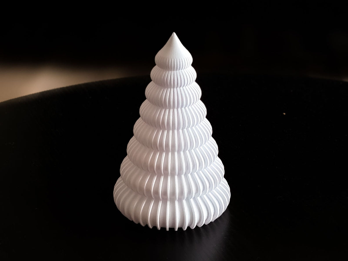 Ribbed Christmas tree with an LED tea light inside