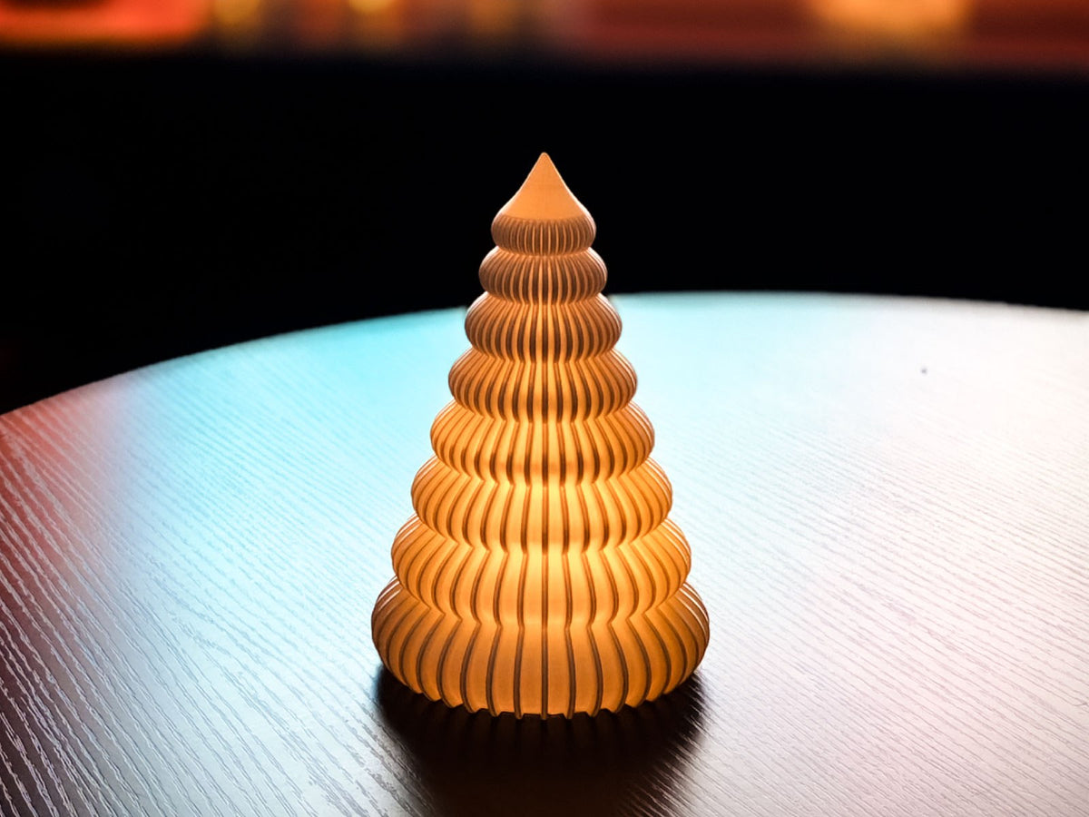 Ribbed Christmas tree with an LED tea light inside