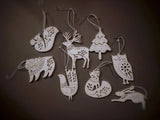 Eight Christmas tree ornaments shaped like animals