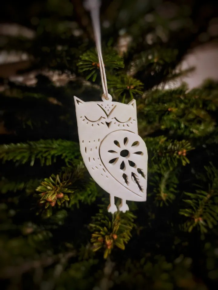 Eight Christmas tree ornaments shaped like animals