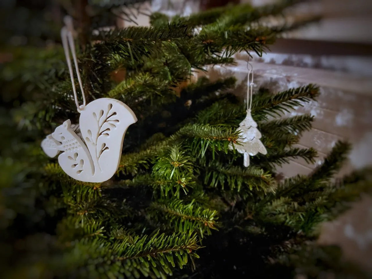 Eight Christmas tree ornaments shaped like animals