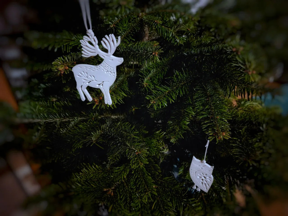 Eight Christmas tree ornaments shaped like animals