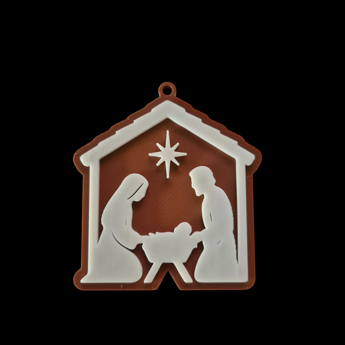 Christmas tree ornament with nativity: Mary, Joseph and baby Jesus