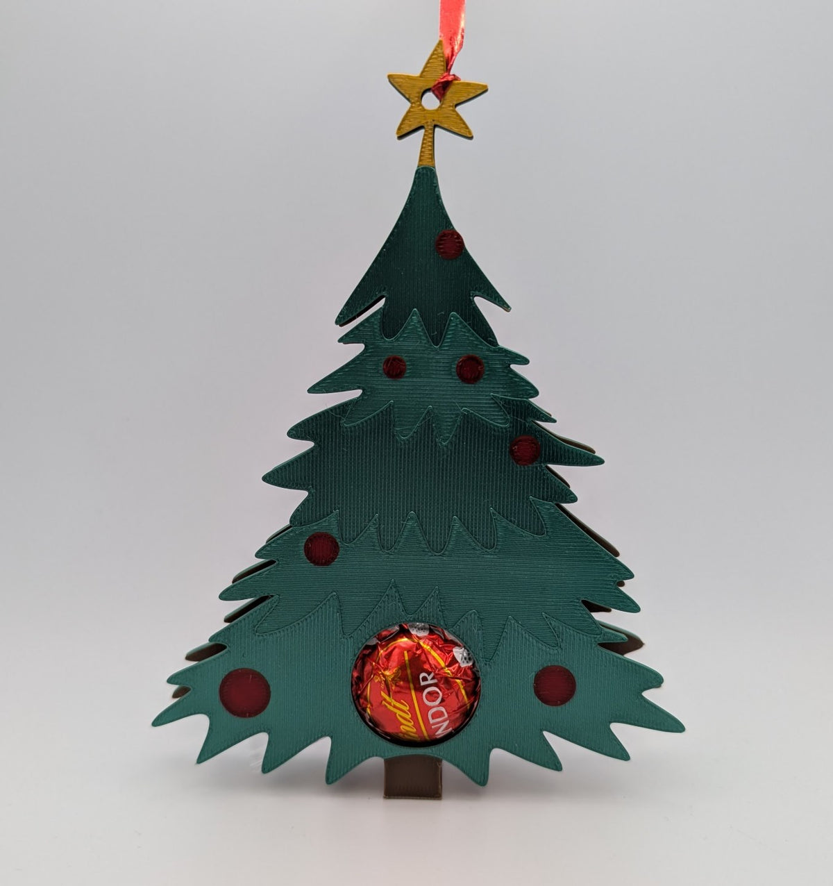Christmas tree ornament that hides a chocolate ball