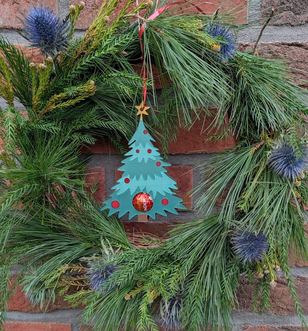 Christmas tree ornament that hides a chocolate ball
