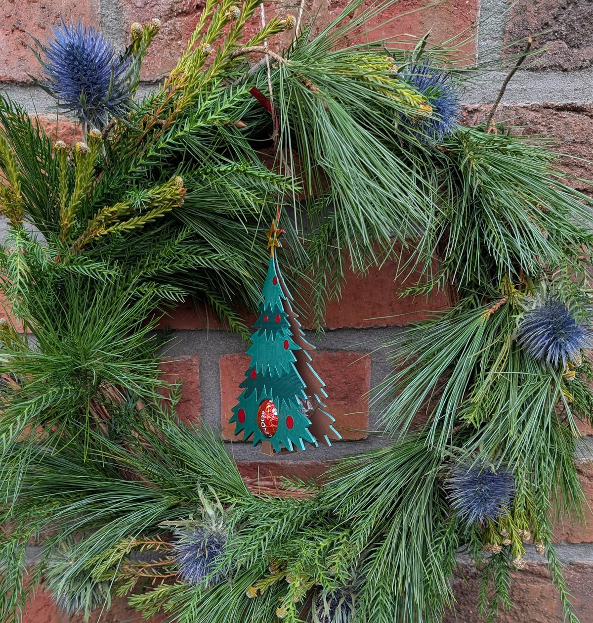 Christmas tree ornament that hides a chocolate ball