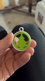 Green Christmas tree in a white ring as a tree ornament