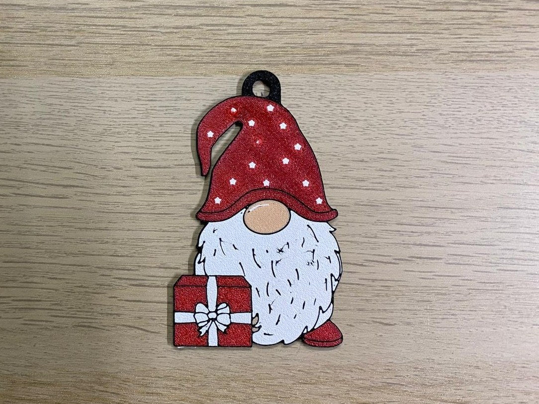 Christmas gnome with a polka-dot hat and red present