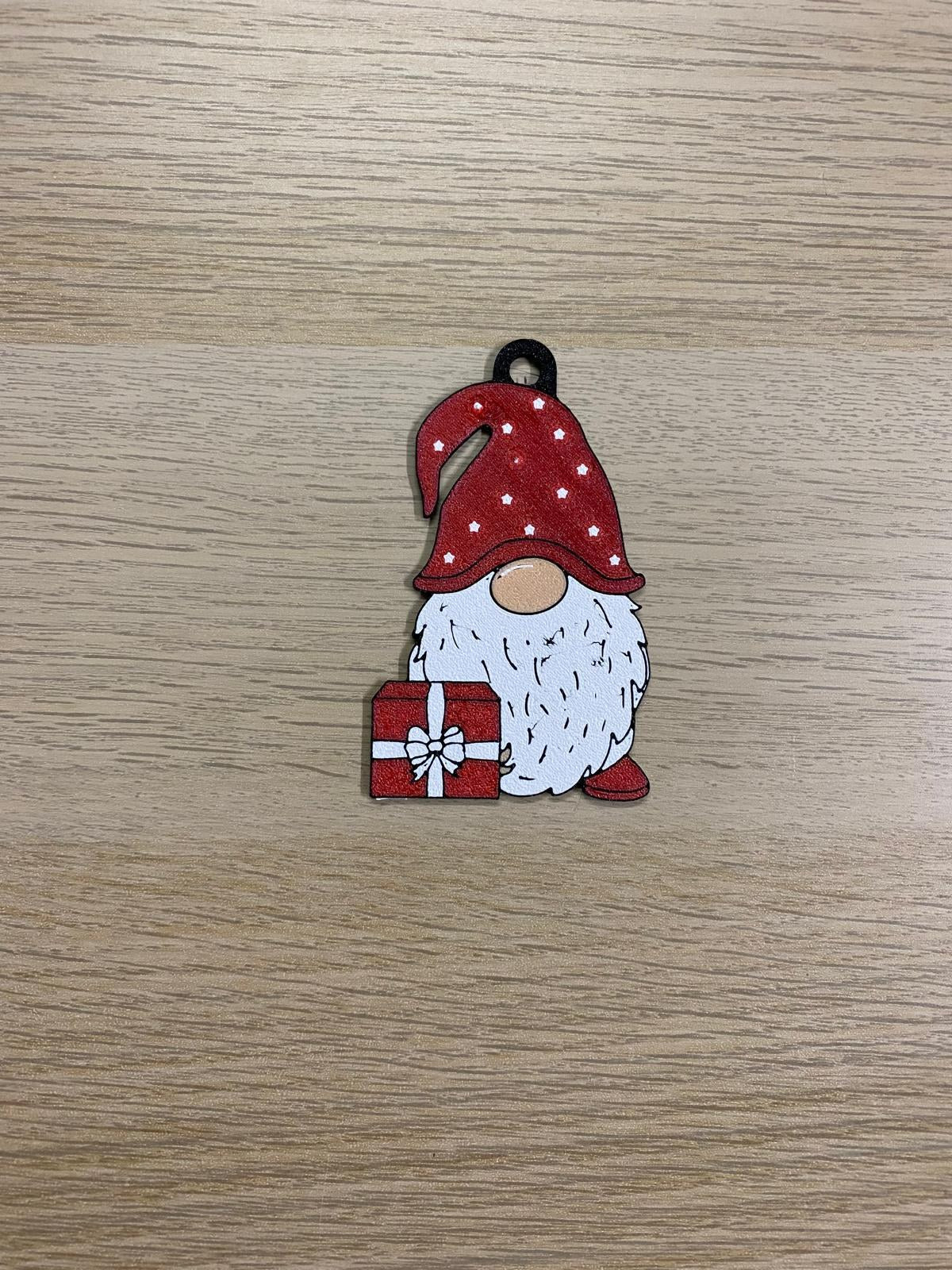 Christmas gnome with a polka-dot hat and red present