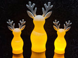 Reindeer figure with textured surface and LED tea light