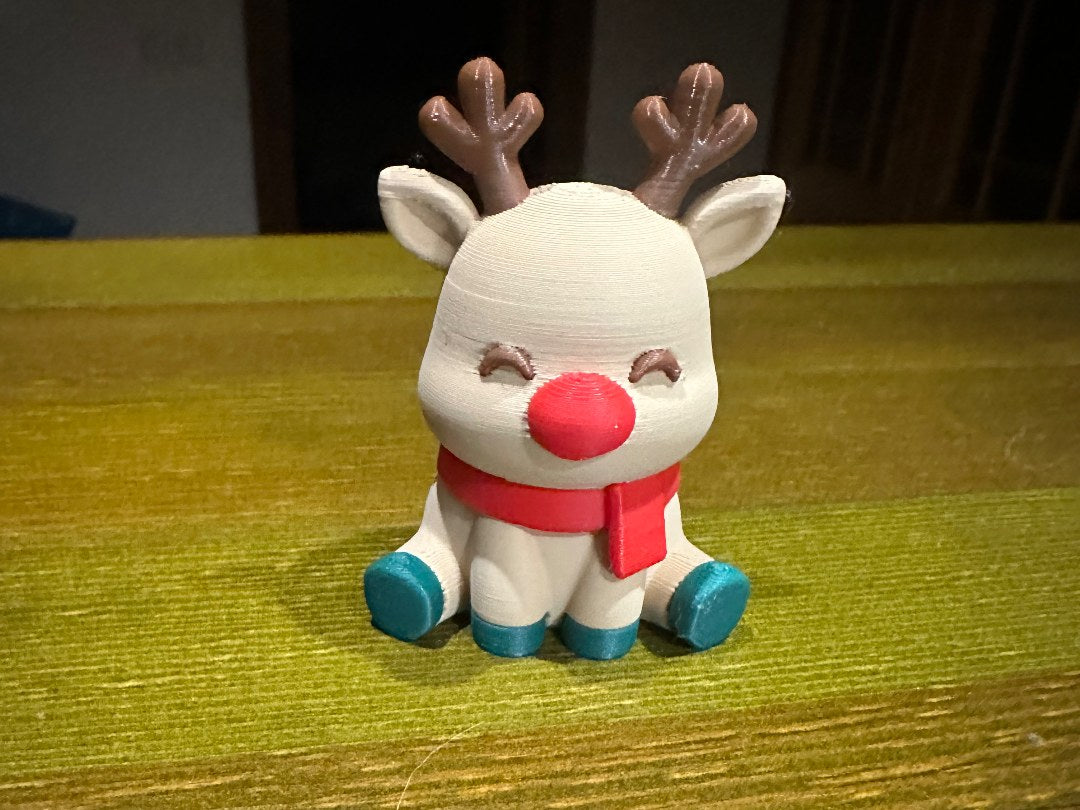Cute reindeer with a red nose and scarf