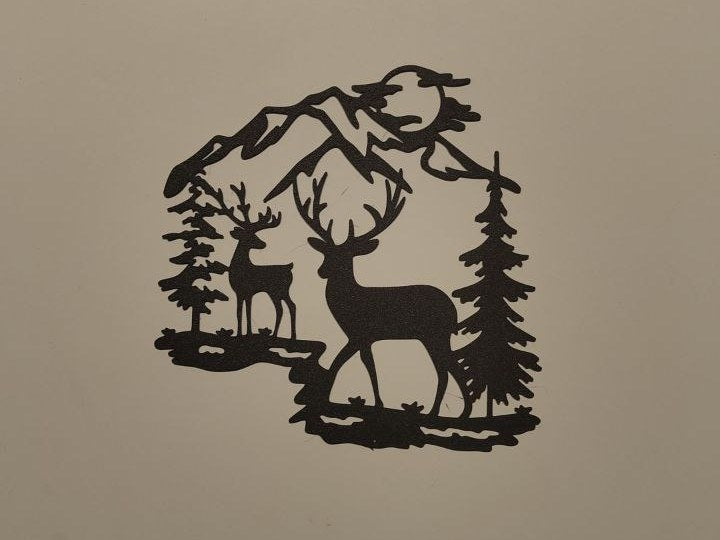 Wall decoration with a reindeer in front of mountains