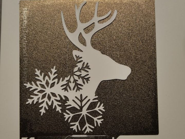 Reindeer silhouette with stars as wall decoration