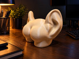 Butt with ears decorative figure seen from the side on a desk